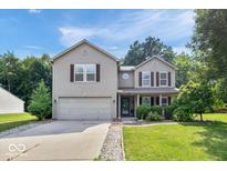 Charming two-story home features a well-manicured lawn and attached two car garage at 1119 Albemarle Cir, Noblesville, IN 46062