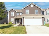 Two-story home featuring a two-car garage, green lawn, and a 'Welcome' sign at 2550 Cedarmill Dr, Franklin, IN 46131