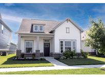 Charming single-Gathering home with a well-manicured lawn and inviting front porch at 485 Washington St, Fortville, IN 46040