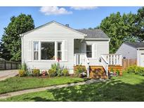 Charming home with landscaped yard and inviting front porch, perfect curb appeal at 5312 Norwaldo Ave, Indianapolis, IN 46220