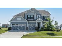 Beautiful two-story home with a well-manicured lawn and two-car garage at 5351 Rose Dr, Zionsville, IN 46077
