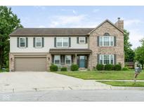 Charming two-story home with a brick and siding exterior, attached garage, and a welcoming front porch at 787 West St, Whiteland, IN 46184