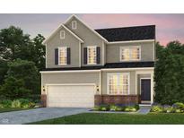 Beautiful two-story home featuring a classic design, attached garage, and perfectly manicured landscaping at 16485 Mount Logan Rd, Noblesville, IN 46060