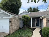 Charming single-story home with manicured landscaping and inviting walkway to the front entrance at 20876 Waterscape Way, Noblesville, IN 46062