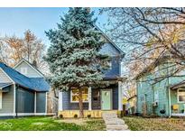 Charming two-story home with a landscaped yard and inviting porch at 430 N Keystone Ave, Indianapolis, IN 46201
