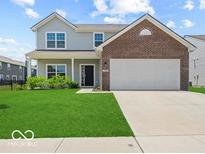 Charming two-story home with a well-maintained lawn and a two-car garage at 1456 Willow Tree Ln, Sheridan, IN 46069