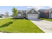 Beautiful single-Gathering home with a well-maintained lawn and a two-car garage at 19195 River Jordan Dr, Westfield, IN 46074