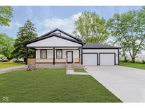 Charming home featuring fresh exterior paint and a spacious two-car garage at 2125 N Pasadena St, Indianapolis, IN 46219