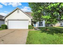 Charming single-story home with a well-maintained lawn and attached two-car garage at 5225 Thompson Park, Indianapolis, IN 46237