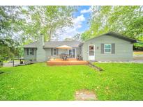 Inviting backyard featuring a spacious deck perfect for outdoor gatherings and relaxation at 8842 S Pleasure Valley Rd, Waldron, IN 46182