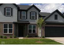 Charming two-story home featuring gray siding, dark accents, and a well-maintained lawn at 900 Cowley Dr, Westfield, IN 46074