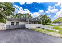 Charming single-story home with a welcoming front porch and accessibility ramp at 1511 E 20Th St, Muncie, IN 47302