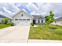 Charming one-story home with a well-manicured lawn, concrete driveway, and attached two-car garage at 2500 Sand Hollow Dr, Lebanon, IN 46052