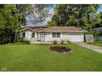 Charming single-story home with a well-manicured lawn and inviting curb appeal at 2807 Carla Ct, Indianapolis, IN 46219