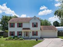 Charming two-story home features red shutters, manicured lawn and attached two car garage at 901 Mallory Pkwy, Franklin, IN 46131