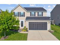 Charming two-story home with a two-car garage and manicured front lawn at 3230 Hemlock St, Whiteland, IN 46184