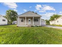 Charming single-story home featuring a welcoming front porch and well-maintained lawn at 4749 W Smith Valley Rd, Greenwood, IN 46142