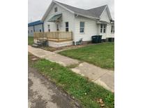 A charming home with a freshly painted exterior and a cozy new front porch at 803 S Pershing Dr, Muncie, IN 47302