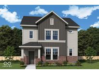 Charming two-story home showcasing neutral siding, black roof, red brick accents, and landscaped front yard at 11998 Vera Ct, Noblesville, IN 46060