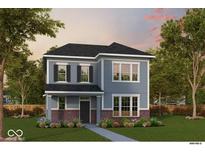 Charming two-story home with blue siding, brick accents, manicured lawn, and inviting landscape at 12222 Vera Ct, Noblesville, IN 46060