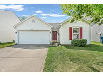 Charming single-story home with white siding, an attached garage, and a well-maintained lawn at 1912 Blue Pine Ln, Indianapolis, IN 46231