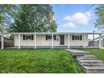 Well-maintained home featuring a classic design, front lawn, and inviting curb appeal at 212 N 13Th St, Elwood, IN 46036