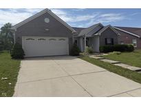 Charming single Gathering home with attached two car garage and a concrete driveway at 2929 Tuscarora Ln, Indianapolis, IN 46217