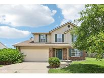 Charming two-story home features a brick facade, green shutters, and well-maintained landscaping at 373 Austin Dr, Avon, IN 46123
