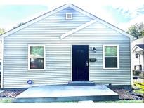 Charming home featuring horizontal siding and a black front door at 3508 Brouse Ave, Indianapolis, IN 46218