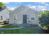 Charming single-story home with gray siding, manicured lawn, and welcoming front entrance at 3508 Brouse Ave, Indianapolis, IN 46218