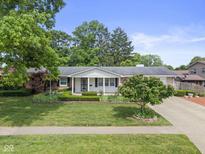Charming brick ranch home featuring a manicured lawn and well-maintained landscaping at 649 Lawndale Dr, Plainfield, IN 46168