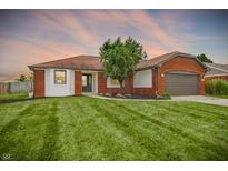 Charming home with a brick and siding exterior, well-manicured lawn, and attached garage, offering great curb appeal at 248 Eastview Dr, Bargersville, IN 46106