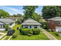Charming one-story home featuring well-maintained landscaping and a quaint, inviting facade at 4708 Fletcher Ave, Indianapolis, IN 46203