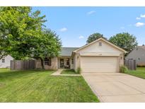Charming single-story home with a two-car garage and well-manicured lawn at 59 Millet Ct, Danville, IN 46122