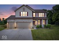 Charming two-story home featuring a three-car garage, brick accents, and well-maintained landscaping at 143 W Clear Lake Ct, Westfield, IN 46074