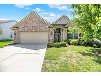 Charming single-story brick home with a well-manicured lawn and an attached two-car garage at 16130 Matlock Cir, Westfield, IN 46074