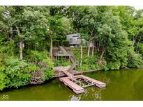 Lakeside home featuring a private dock and access to the water at 18 Point Ln, Arcadia, IN 46030