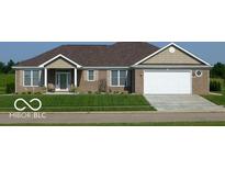Charming brick home with a well-manicured lawn and attached two car garage at 204 St Andrews Ave, Edinburgh, IN 46124