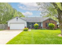 Charming single-story home with brick accents, a lush lawn, and an attached two-car garage at 2443 S Brandywine Ct, Greenfield, IN 46140