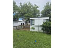Exterior of a mobile home featuring a ramp and deck at 3216 Memorial N Dr, Elwood, IN 46036