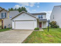 Charming two-story home with a well-maintained lawn and a two-car garage at 10246 Liverpool Way, Indianapolis, IN 46236