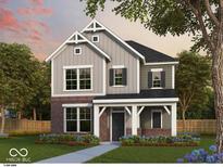 Charming two-story home with gray siding, brick accents, and a welcoming covered porch at 12210 Vera Ct, Noblesville, IN 46060