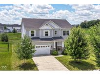 Beautiful two-story home featuring a well-manicured lawn, a two-car garage and traditional architectural details at 15984 Conductors Dr, Westfield, IN 46074