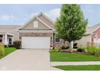 Charming brick and siding home featuring a two-car garage and well-maintained front yard at 16573 Grappa Trl, Fishers, IN 46037