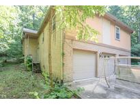 Spacious two-story home with a three-car garage and a brick exterior at 7303 W Division Rd, Bargersville, IN 46106