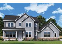 Charming two-story home showcasing gray siding, black roof and complemented by professionally landscaped yard at 19614 Wood Farm Pl, Westfield, IN 46074
