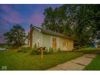 Charming home showcasing lush greenery and a well-maintained front yard at 2627 Chase St, Anderson, IN 46016