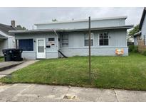 Charming single-story home featuring a cozy front yard, light blue siding and white trim at 2731 Delaware St, Anderson, IN 46016