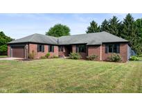Beautiful brick home with an attached garage and well manicured front lawn at 180 Wellington Pkwy, Noblesville, IN 46060