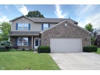 Charming two-story home with brick and siding, plus a well-kept lawn and landscaping at 3903 Junco Cir, Indianapolis, IN 46228
